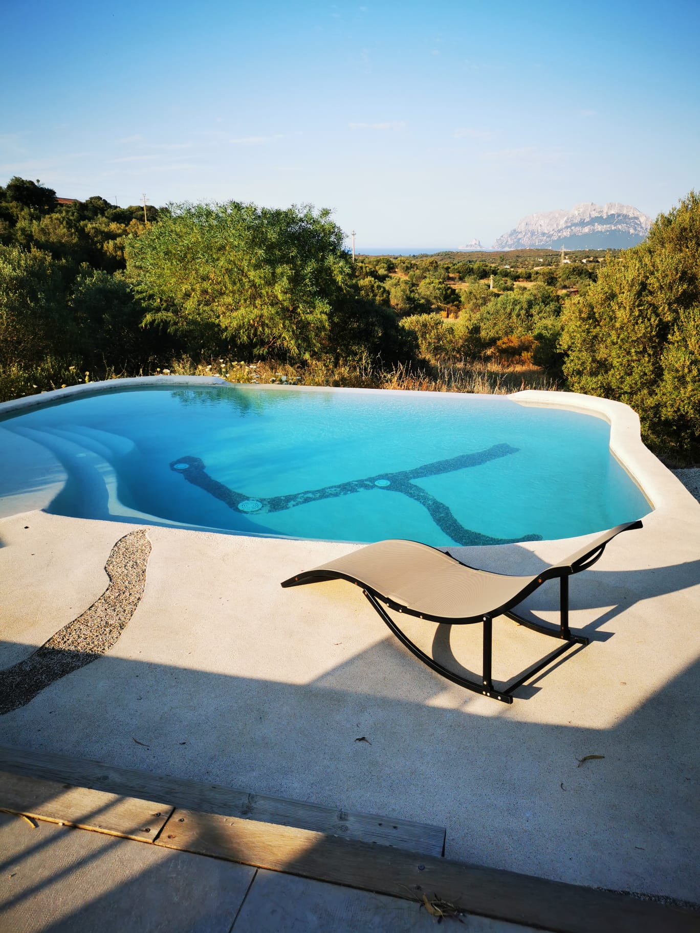 Poolside lounger with panoramic sea view