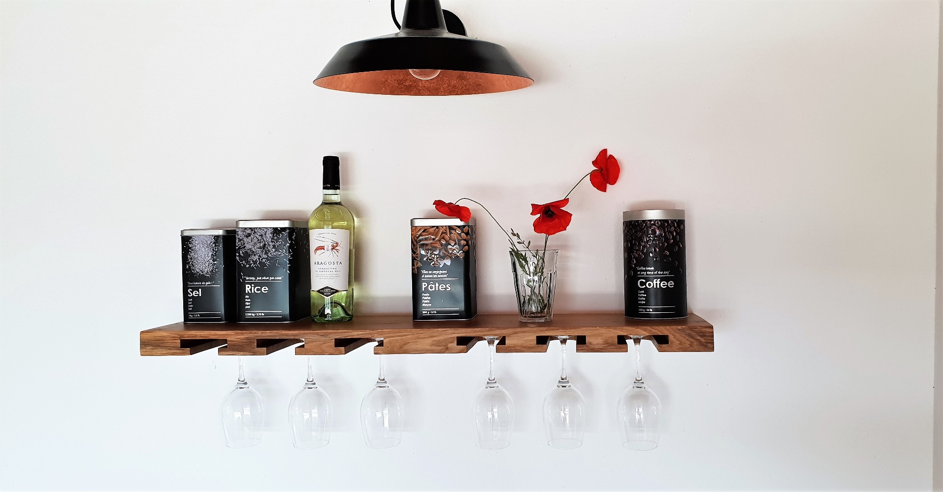 Kitchen shelf with Sardinian wine and Mediterranean details