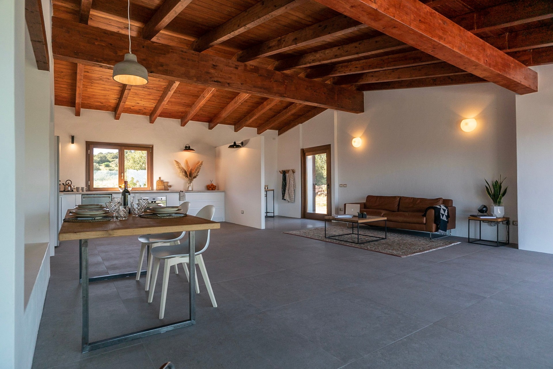 Living and dining area with vaulted beam ceiling